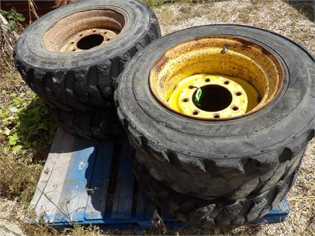 10-16.5 SKID STEER TIRES W / 8 BOLT RIMS