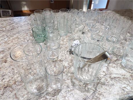ASSORTMENT OF GLASSWARE - SHOT GLASSES - GLASS ICE BUCKET - VASE